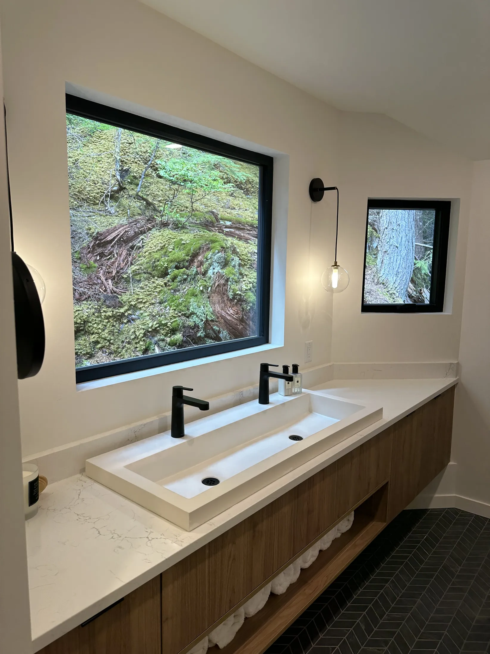 Wet bar nook under a dormered wood ceiling: built-in wine fridge, quartz prep counter with sink.